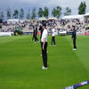 New Zealand players warming up with Chris Harris in the foreground