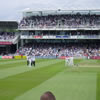 Umpires and England batsmen at drinks