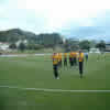 Paul Hitchcock leads the Wellington team off the field after his great figures of 5/10