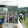 Daniel Vettori holds one the of the stumps the others sign autographs