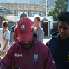 Brian Lara signs an autograph.