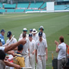 A bunch of England players leave the field at the close of play