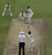 Beau Casson bowling to Aaron Redmond